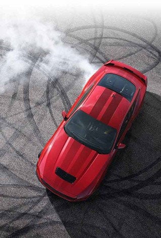 Overhead view of a 2024 Ford Mustang® model with tire tracks on pavement | Parks Ford of Wesley Chapel in Wesley Chapel FL